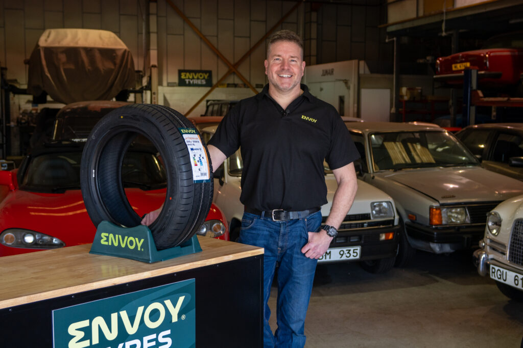 Paul Cowland stood next to the Aterna passenger car tyre from Envoy Tyres